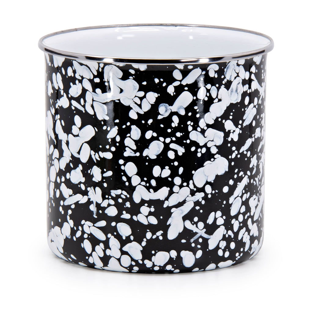 Black Swirl enamelware utensil holder with stainless steel trim on a kitchen countertop.