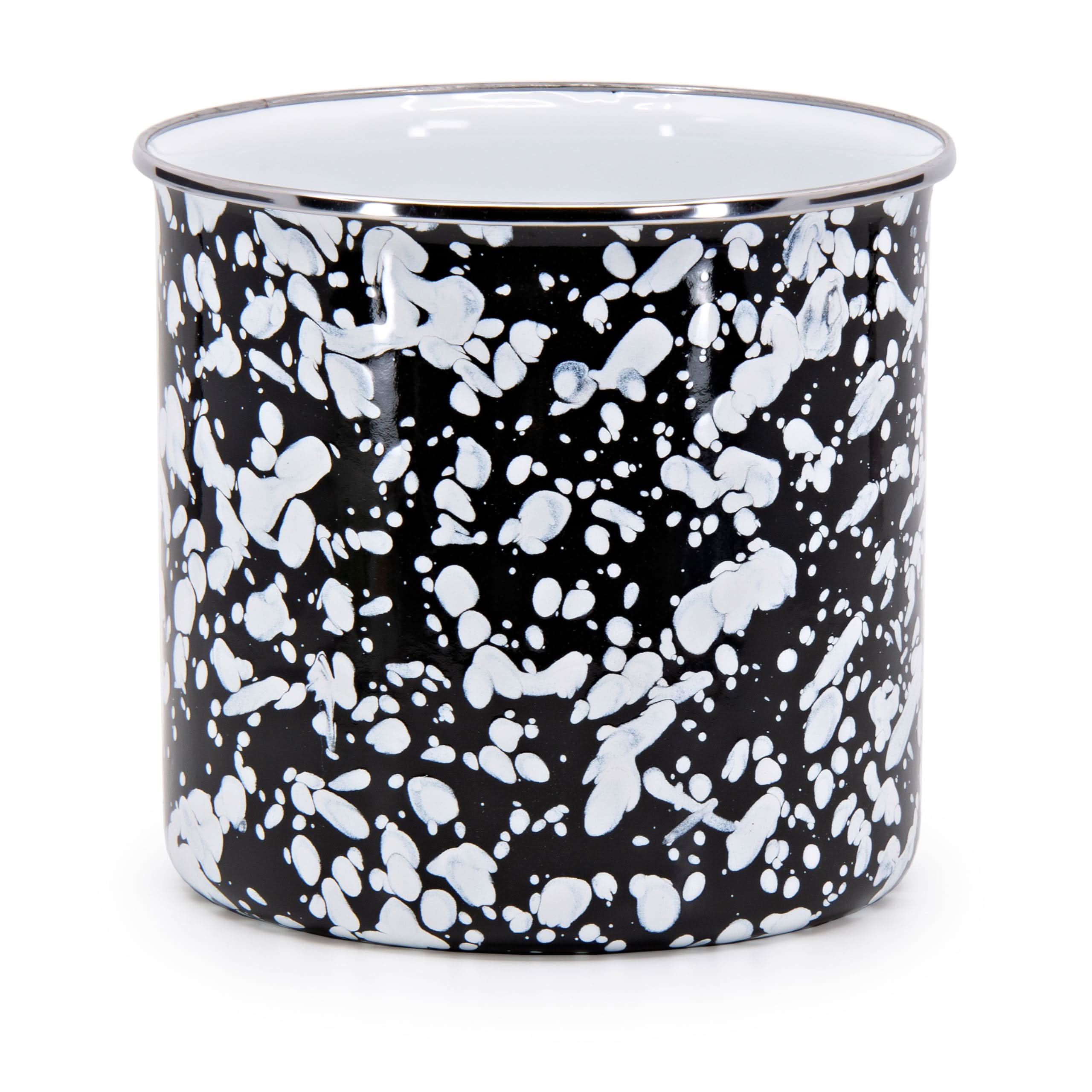 Black Swirl enamelware utensil holder with stainless steel trim on a kitchen countertop.