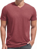 A man wearing a premium fitted modern V-neck t-shirt in a neutral color, showcasing the form-fitting cut.