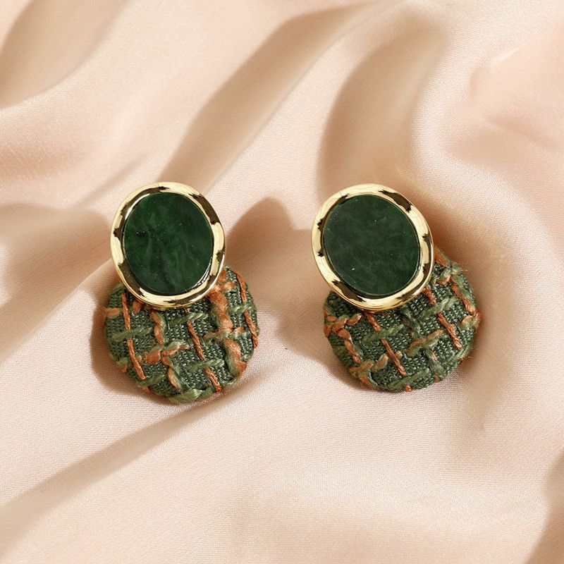 A pair of chic green woven stud earrings in a minimalist Korean style design.