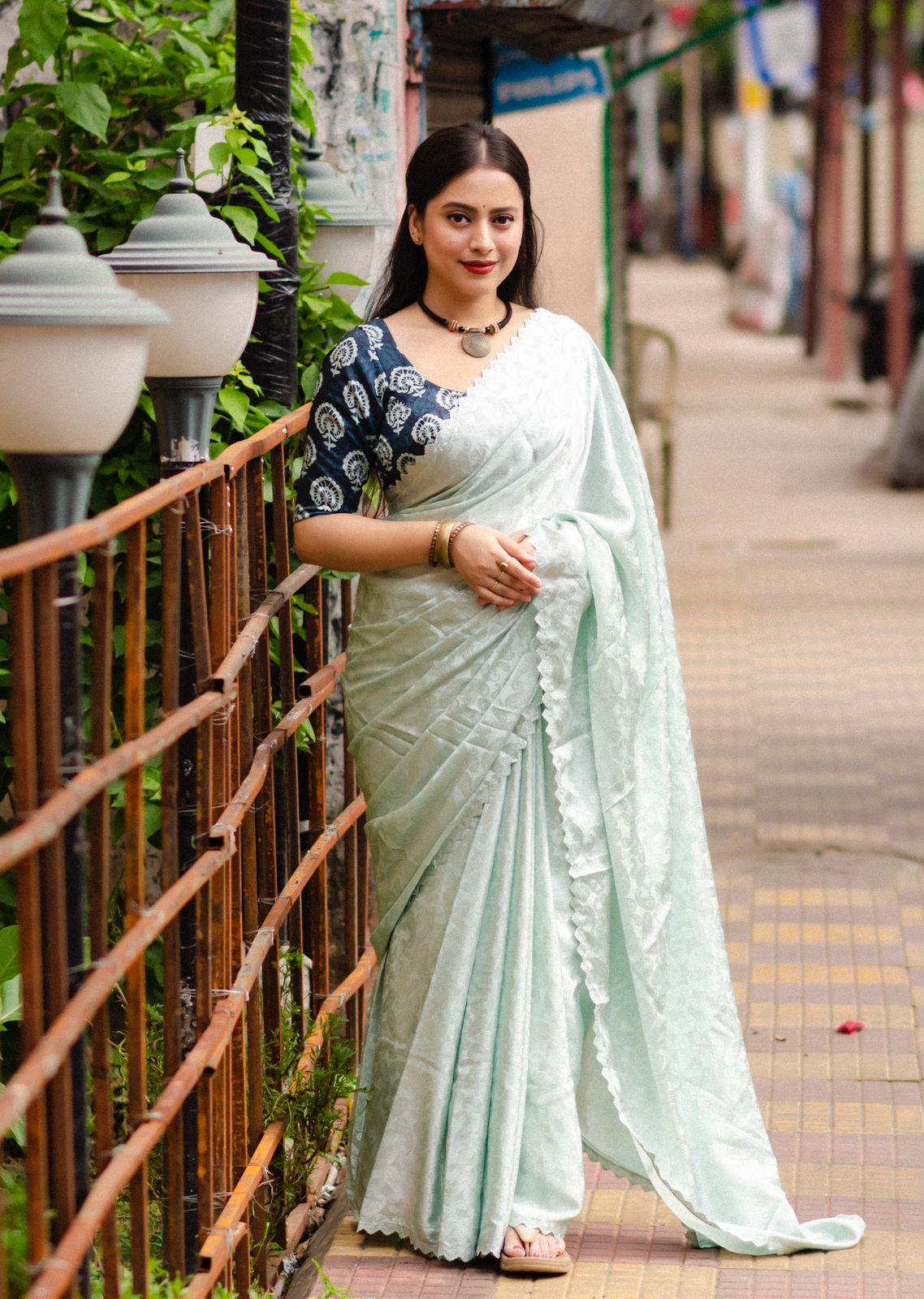 Blue poly silk saree with intricate mango woven motifs and fancy cutwork border