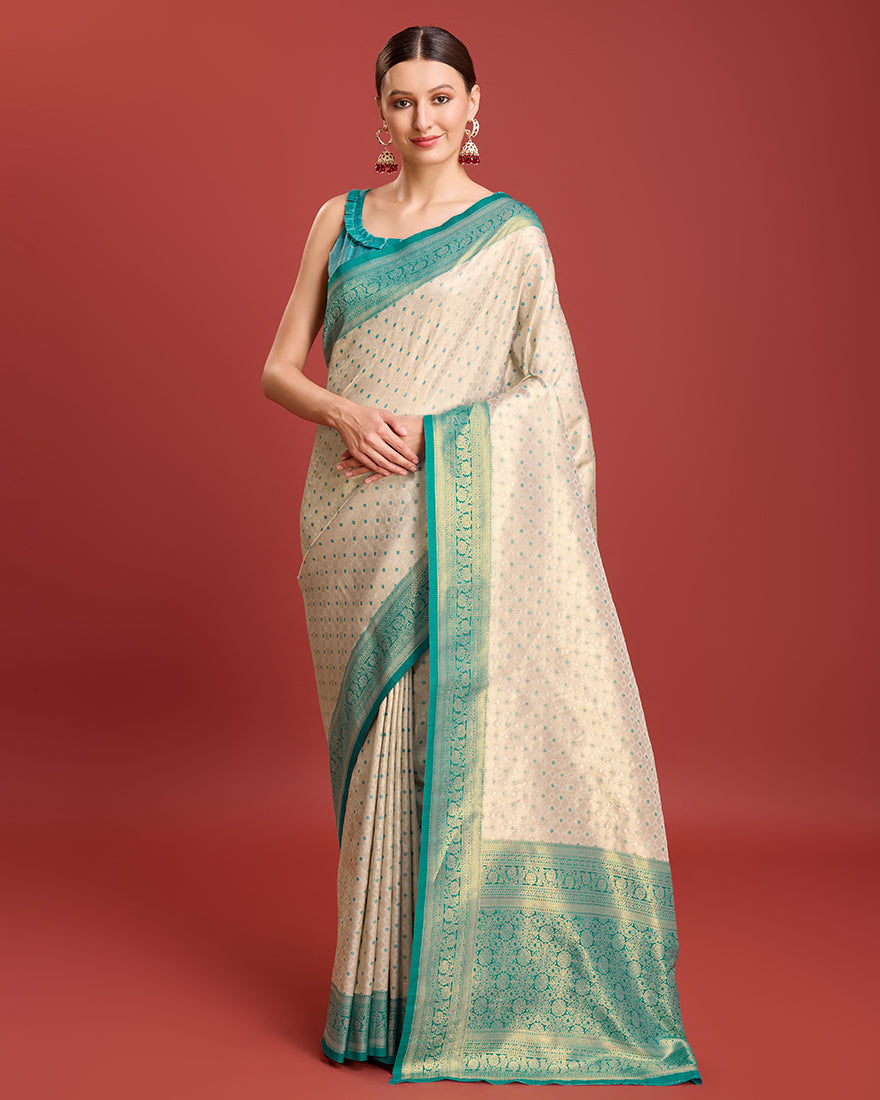 Elegant turquoise Kanjivaram silk saree featuring traditional zari weave.