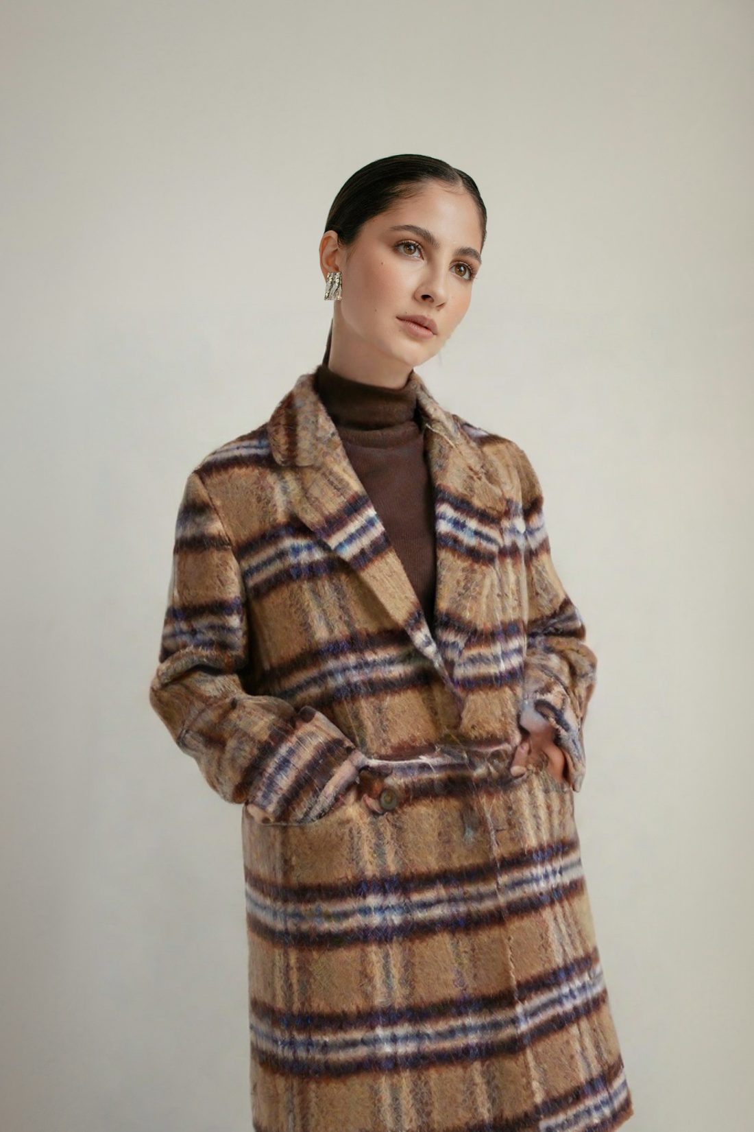 Model wearing a women's plaid triacetate mid-length coat in tan, blue, and red, styled in a Harajuku fashion.