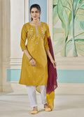 Woman wearing a mustard pure viscose straight kurta with weaving stripes and embroidery