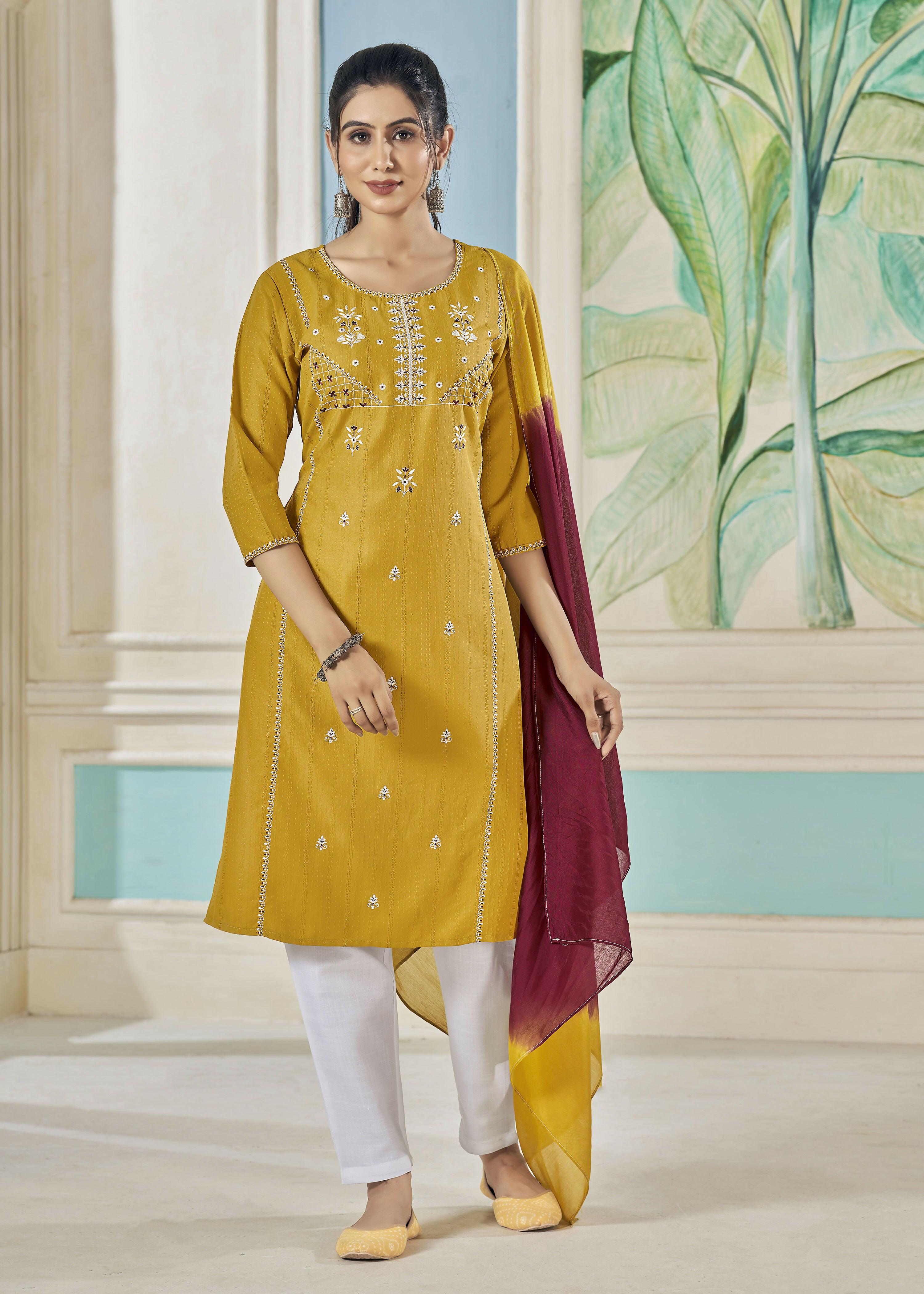 Woman wearing a mustard pure viscose straight kurta with weaving stripes and embroidery
