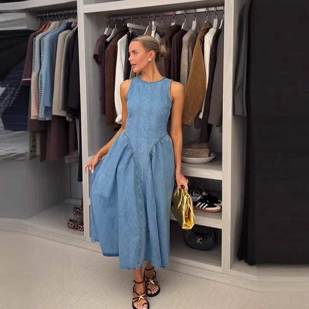 Back view of a woman wearing a blue high-waisted denim long skirt with lace-up detailing