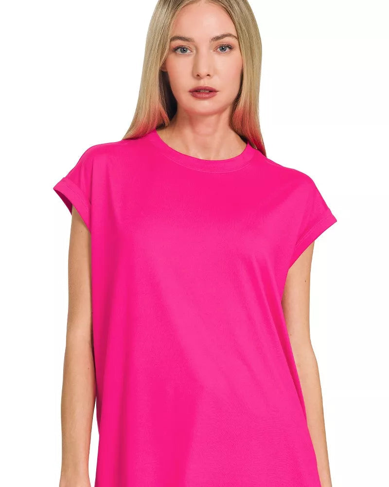 Woman wearing a bright pink t-shirt on a white background