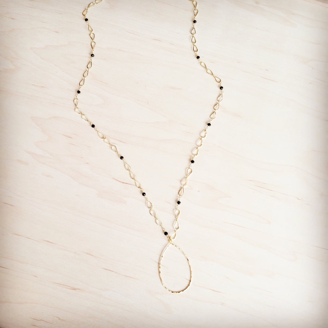 Gold-Tone Infinity Chain Necklace with Black Faceted Beads - Image 2