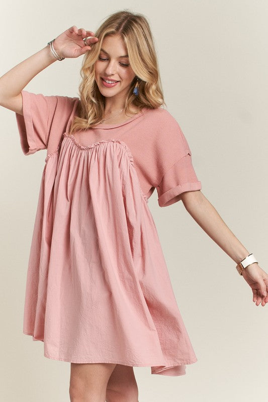 Feminine round neck babydoll dress with half sleeves in a classic silhouette