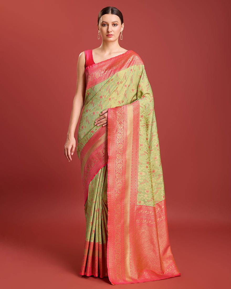 Pastel green Banarasi tissue silk saree with intricate gold zari weaving