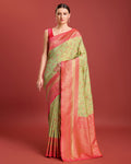 Pastel green Banarasi tissue silk saree with intricate gold zari weaving