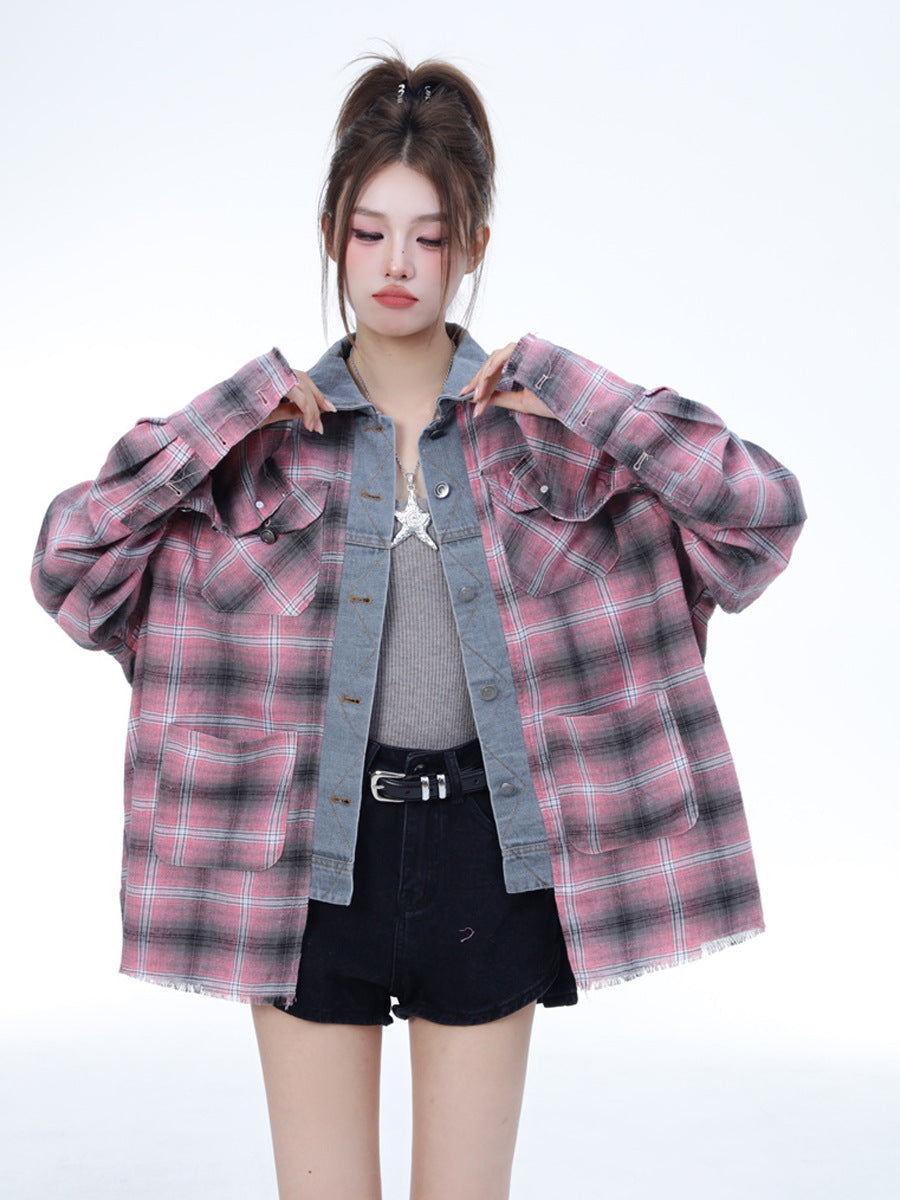 A model wears a women's pink and black plaid oversized long sleeve top with denim patchwork detail, styled with a grey tank top and black shorts against a white background.