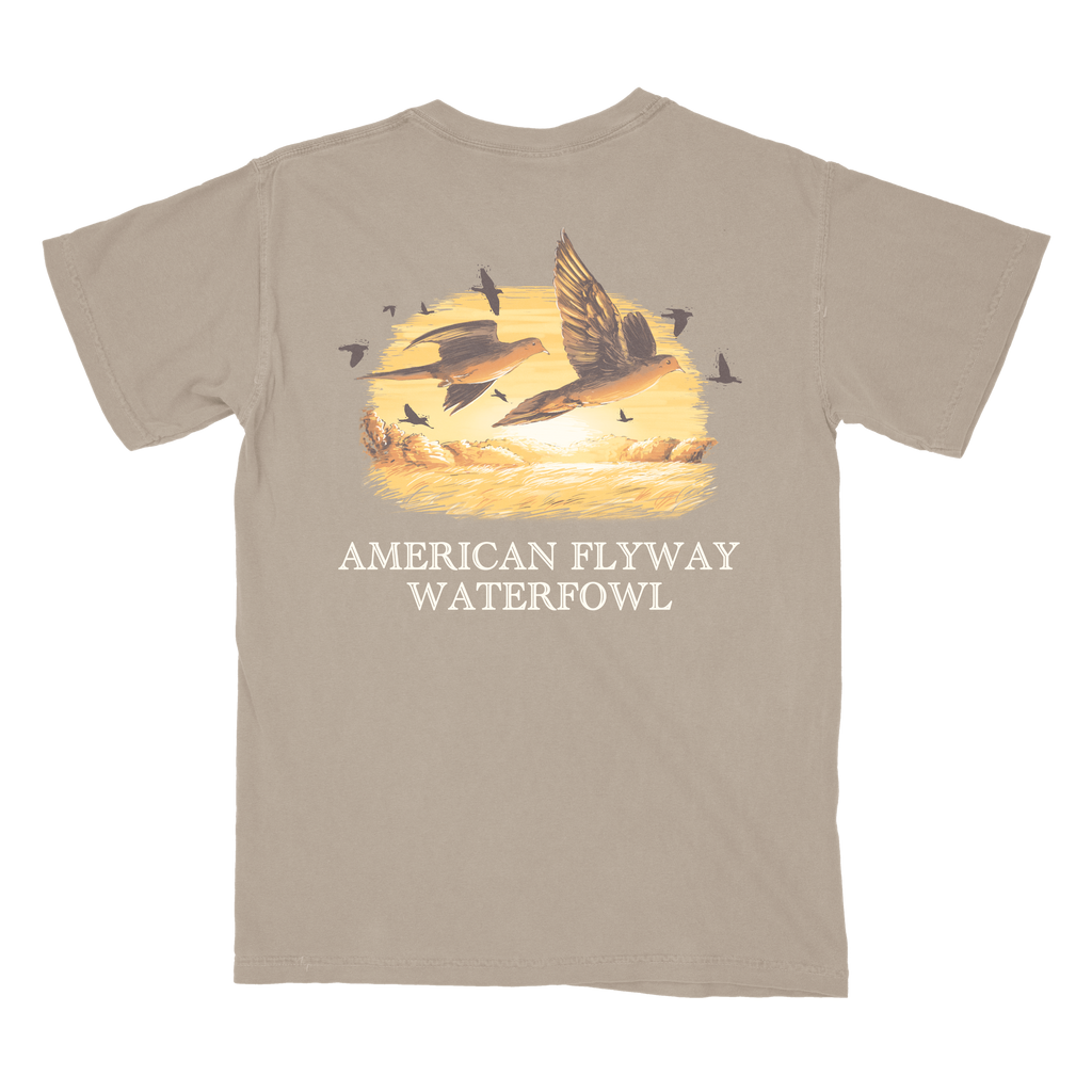 Unisex Dove Season graphic tee in tan and brown cotton featuring a flying dove illustration.