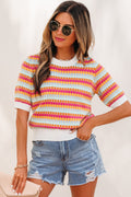 Women wearing Bellamy short sleeve knit sweater with abstract stripes in white, light-blue, orange, and fuchsia