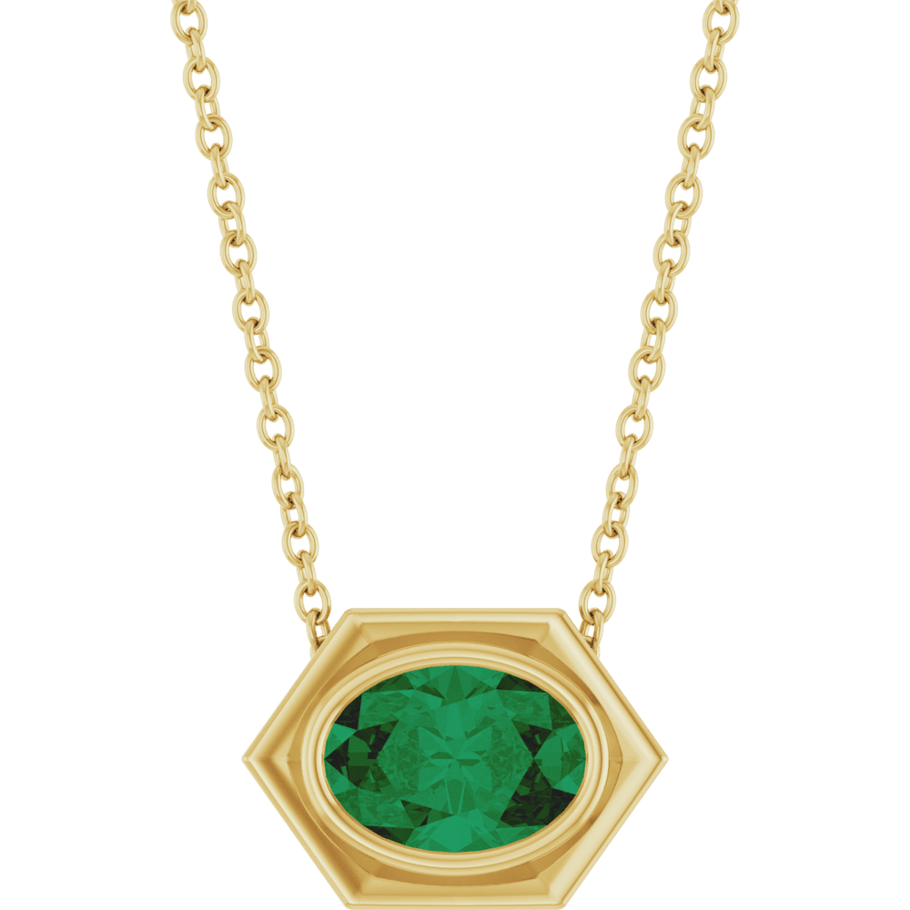 14K yellow gold hexagonal pendant necklace with an oval emerald gemstone