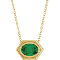 14K yellow gold hexagonal pendant necklace with an oval emerald gemstone