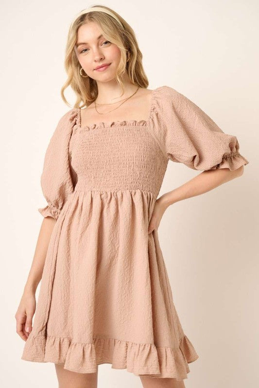 Smocked bodice mini dress with half sleeves and ruffled hem