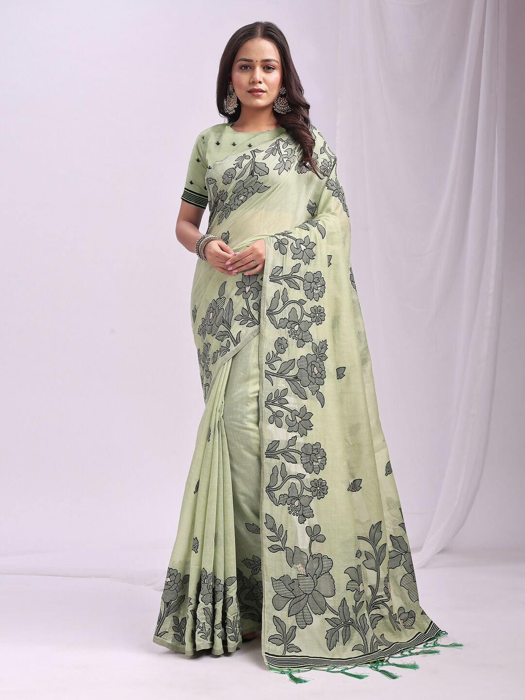 Light green linen cotton saree with a soft textured finish