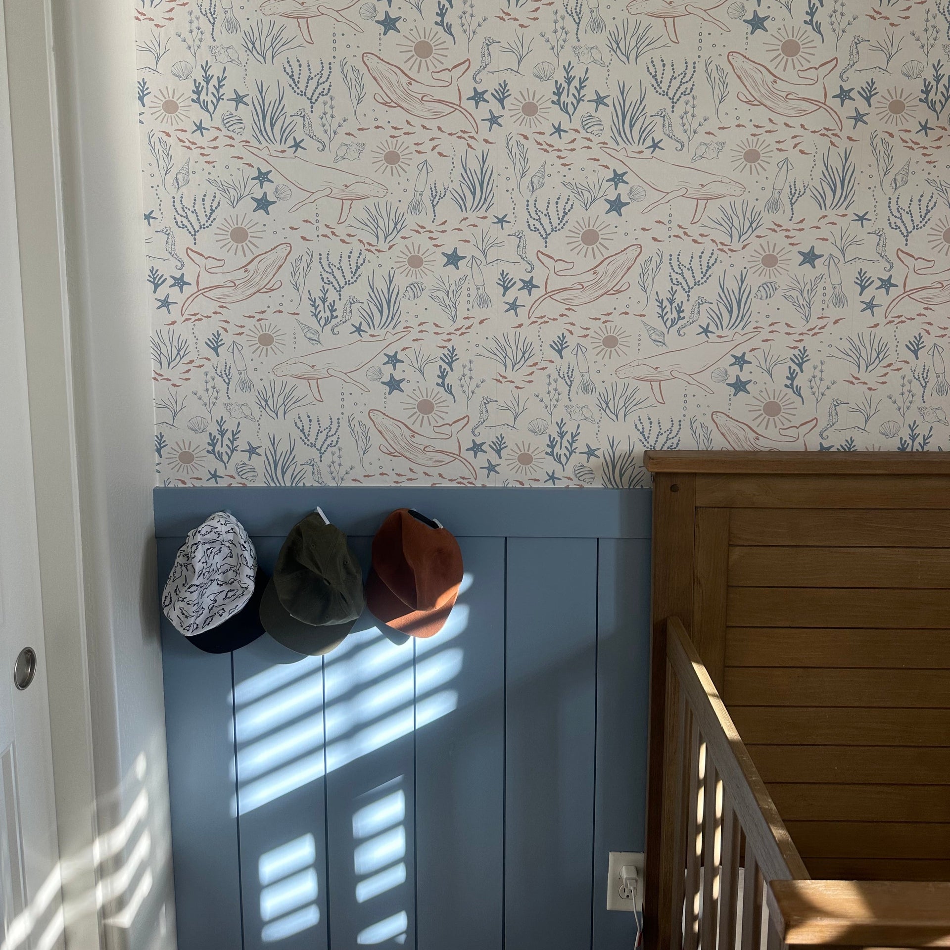 Delmar Wallpaper by Hufton Studio featuring a decorative pattern on an interior wall