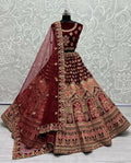 Close up of Maroon Velvet Wedding Lehenga with intricate multi-thread embroidery and zircon diamonds.