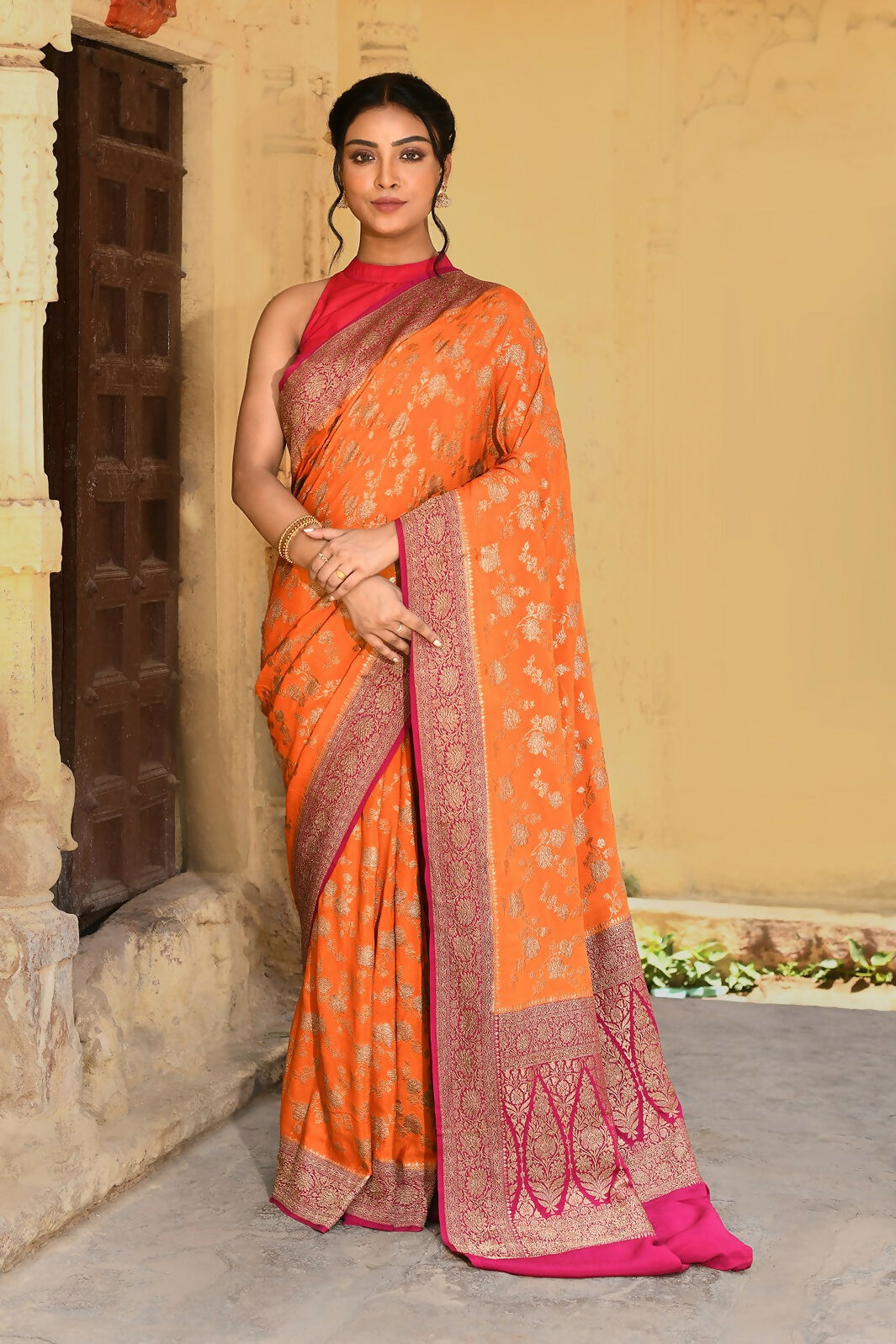 Bright Orange Crepe Chiffon Pure Handloom Banarasi Silk Saree.