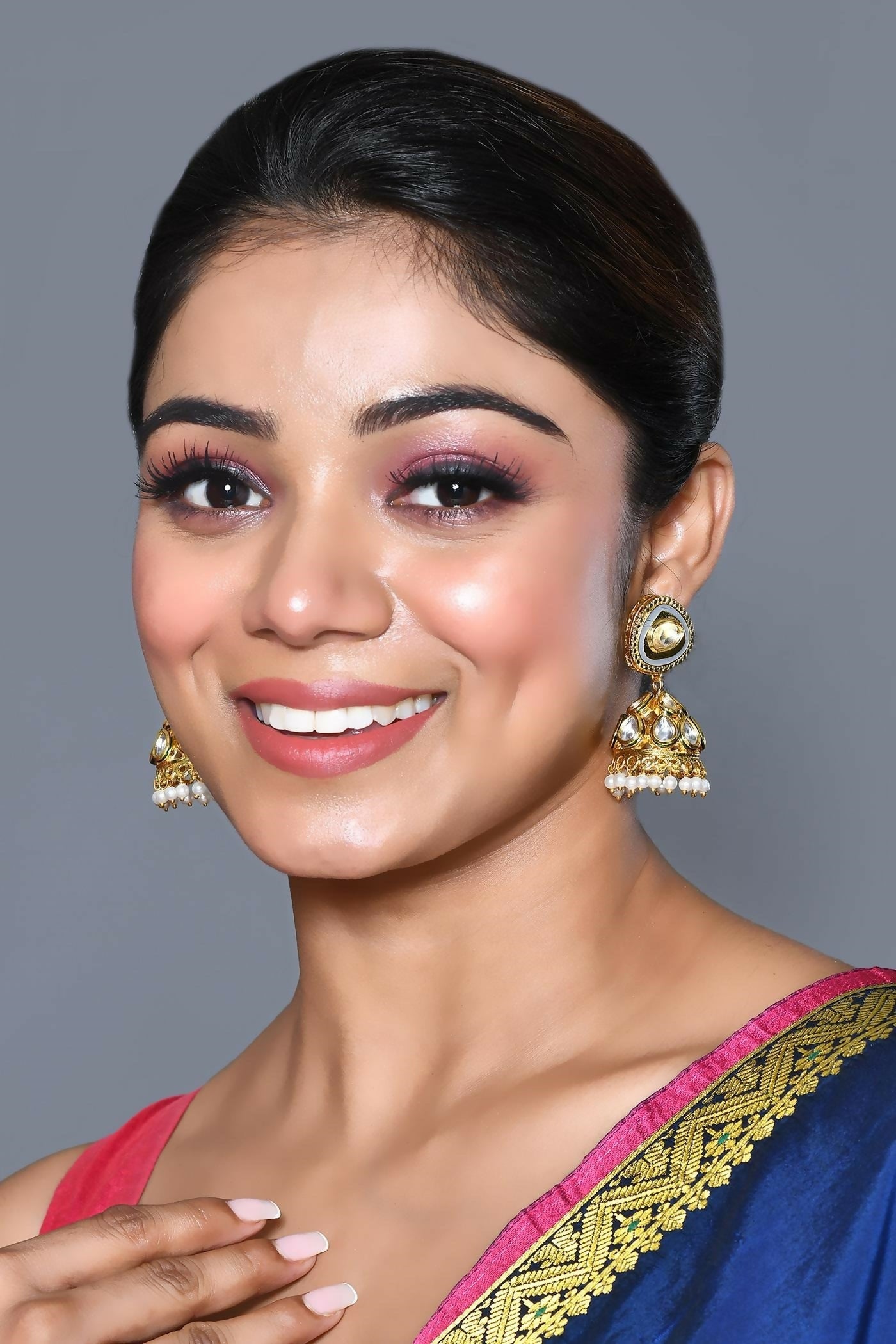 Exquisite Kundan Pearl earrings in Golden, White, and Grey tones.