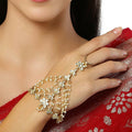 A pair of elegant crème colored Kundan Hathphool hand accessories crafted from brass.