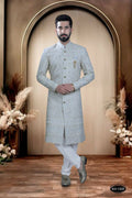 Toddler boy wearing a blue georgette kurta with intricate thread and sequence embroidery