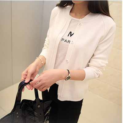 Vintage style open front knit cardigan with cutout details worn as a lightweight sunscreen cape