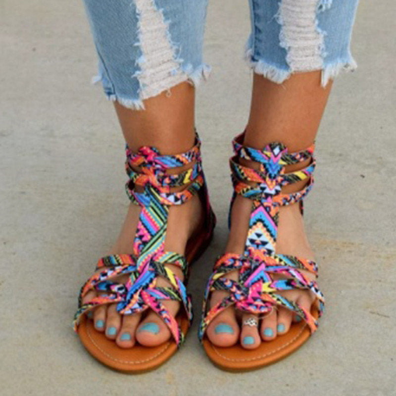 Women's retro-style leather sandals with unique strap patterns and arch support