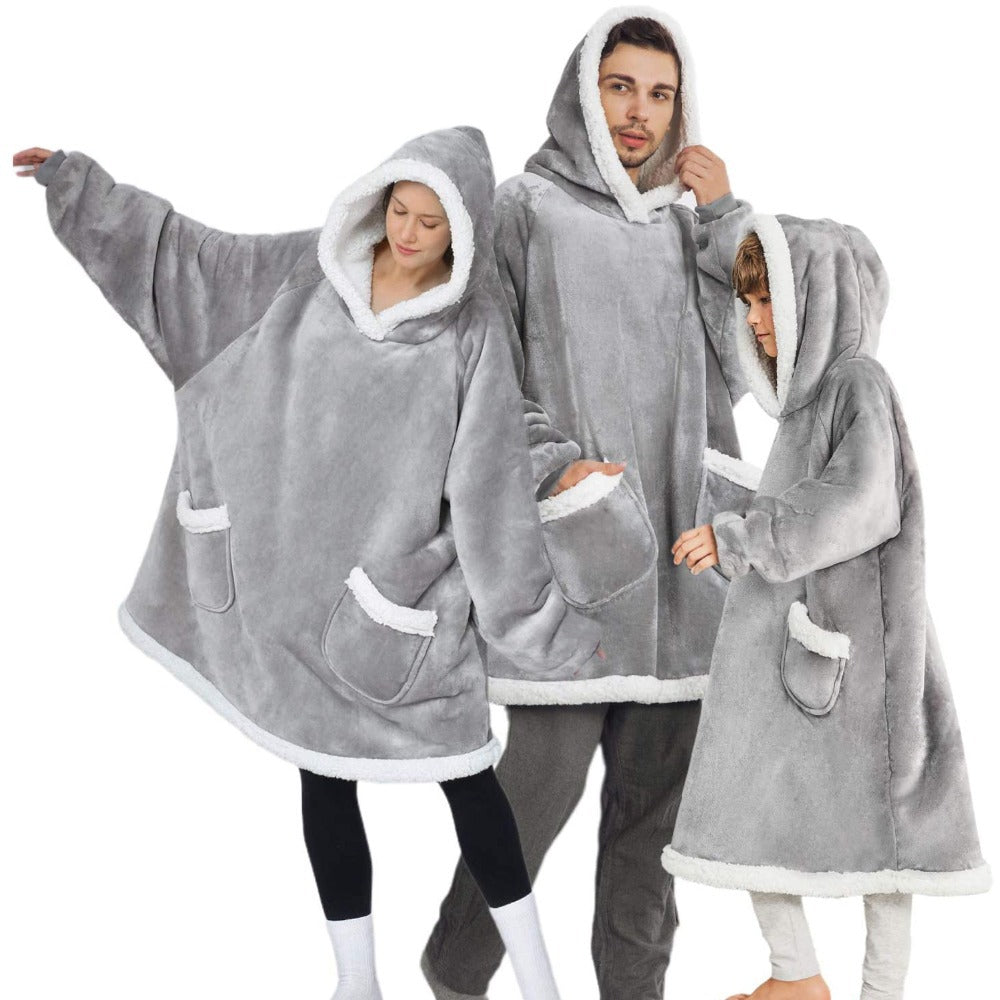 Modern oversized fleece wearable blanket hoodie with a front pocket for lounging at home.