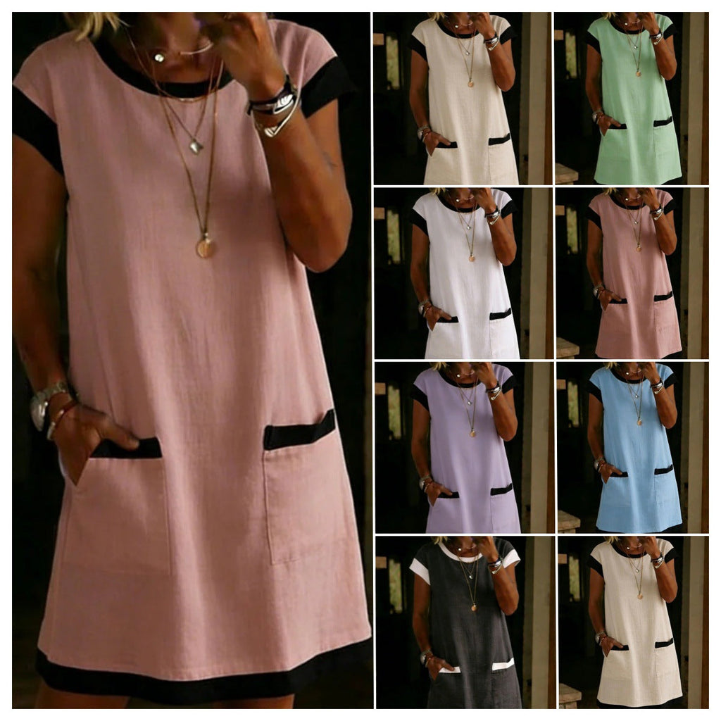 A woman wearing a color-block mini dress with front pockets and contrasting trim.