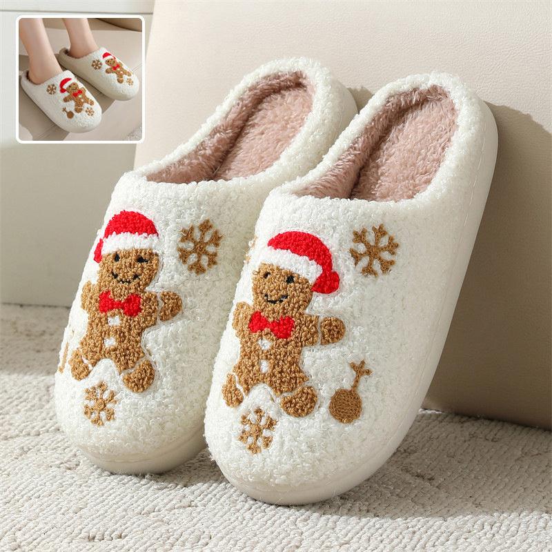 Close up of festive Gingerbread Man patterned house slippers with plush interior and slip-on design.