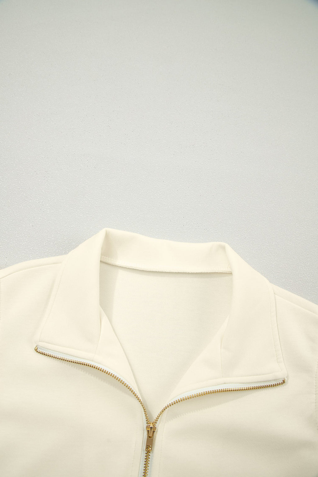 Juniper Ruffled Short Sleeve Blouse in Off-White and Cream