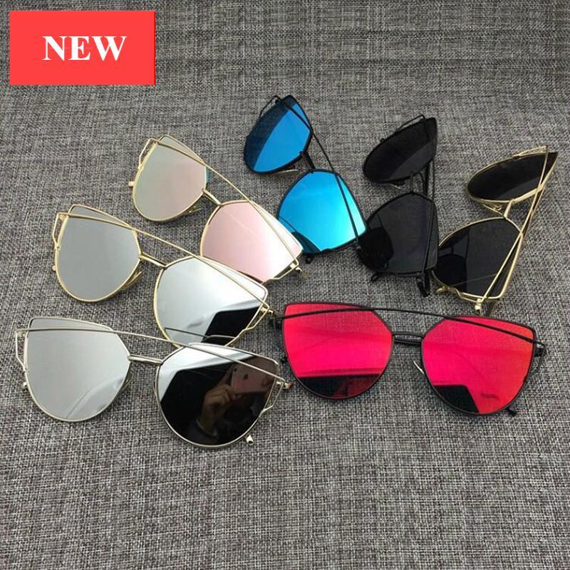 Vintage cat eye sunglasses with metal frames and reflective mirror lenses