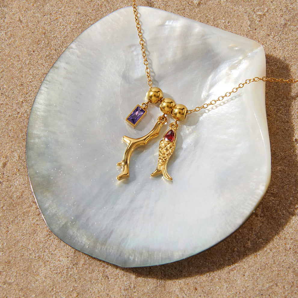Zircon Fish Pendant Necklace in Gold with Coral Accents
