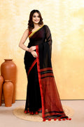 Black handloom cotton saree with intricate embellishments worn as elegant ethnic wear