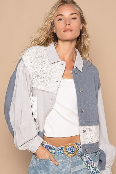 Artistic crochet patch button-up jacket in grey, blue, and white with exposed seams