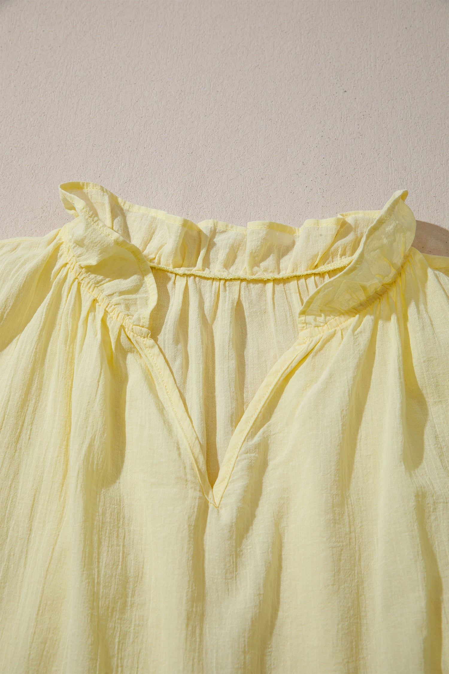 Solid V-Neck Sleeveless Top with Ruffle Trim in Yellow