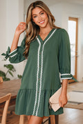Xyla Bracelet Sleeve Shift Dress in a flowy silhouette with ricrac trim and knotted sleeve detail