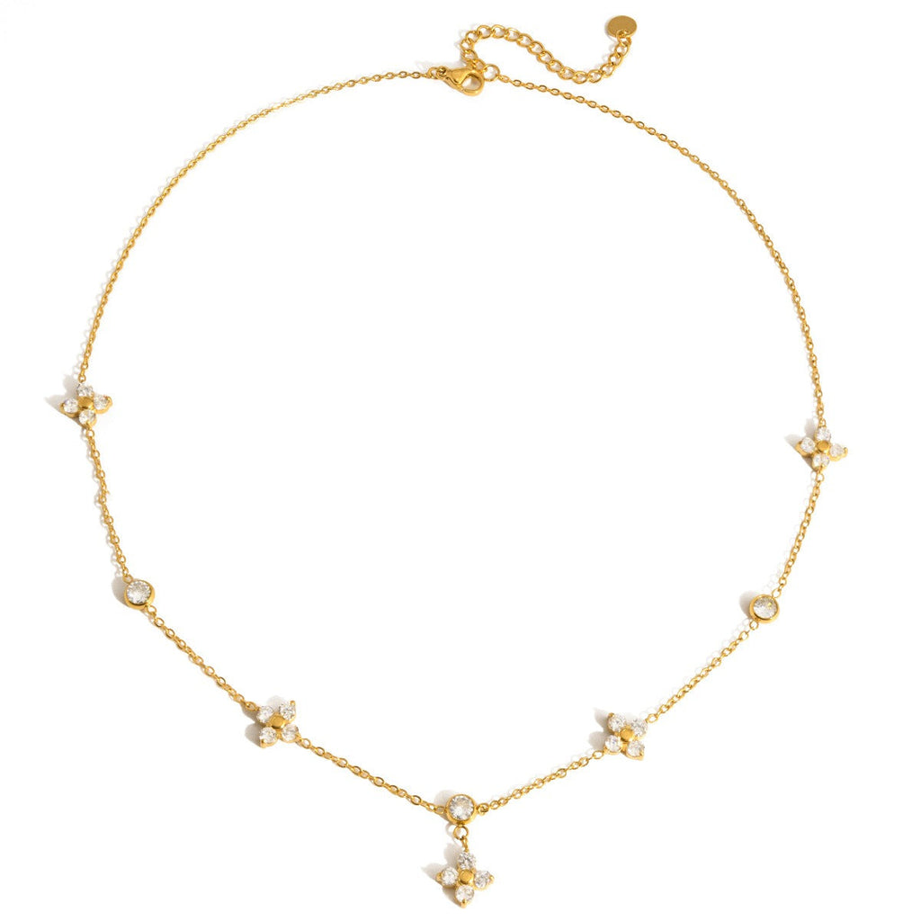 18K gold four-leaf clover pendant necklace featuring sparkling zircons on a delicate chain