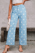 High-waisted light blue and white polka dot shift jeans with a raw hem finish