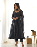 Model wearing a black 3-piece georgette kurta set with detailed sequence embroidery work