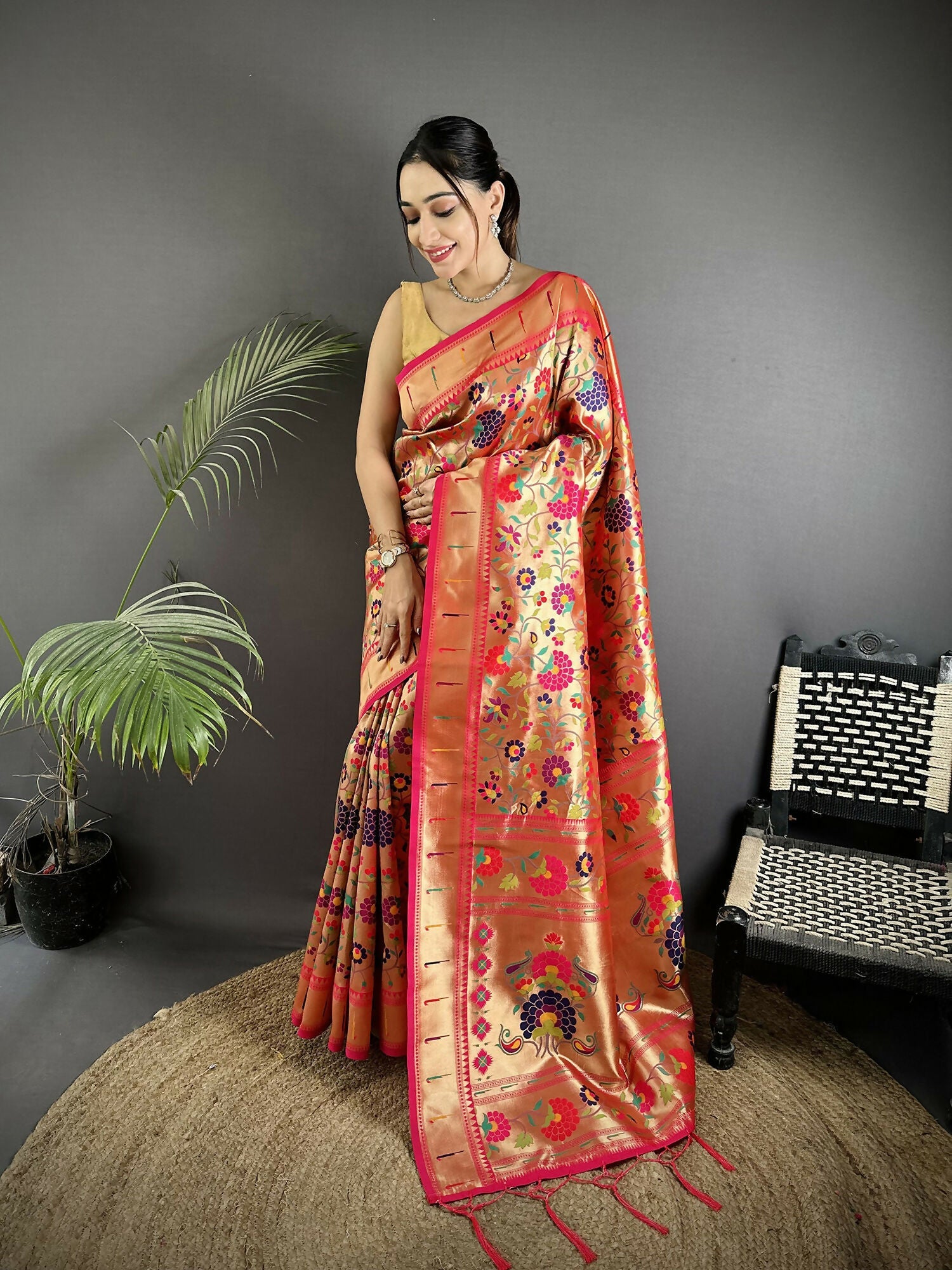 Golden-Orange soft silk Paithani saree with intricate floral and leaf motifs