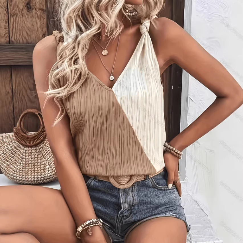 Model wearing a white relaxed-fit sleeveless V-neck camisole top, perfect for a bohemian summer look.