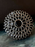 Oversized bohemian statement ring featuring a black cabochon Monalisa stone in an antiqued silver-tone brass setting.
