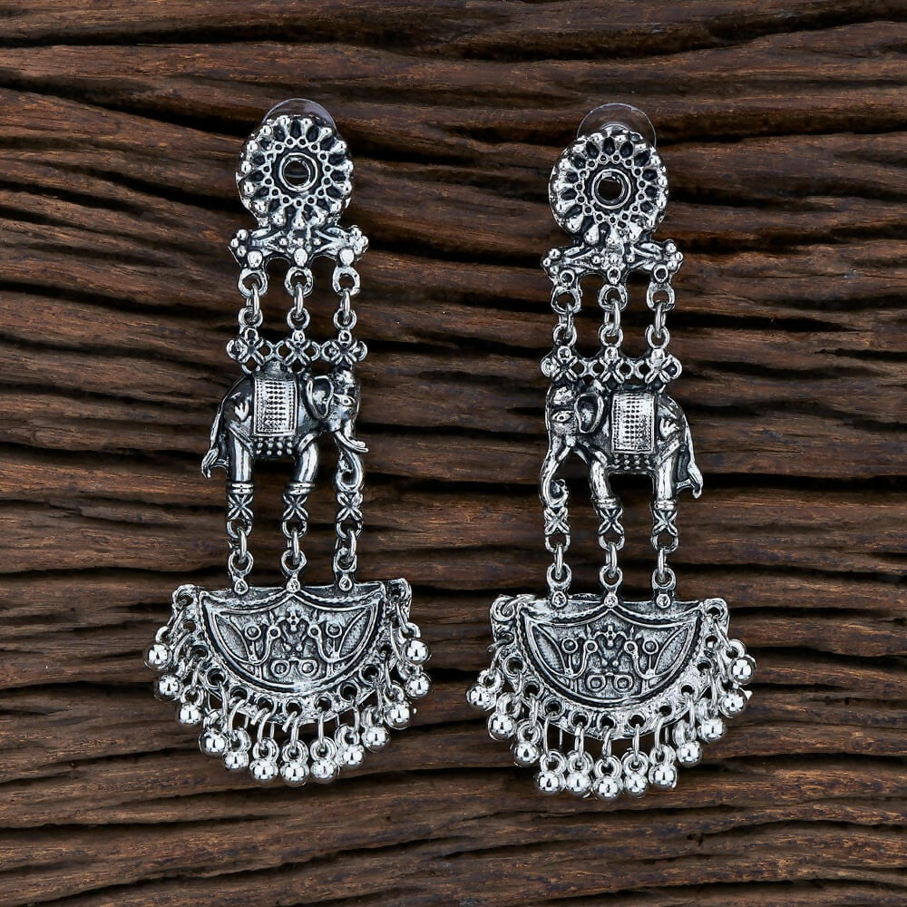 Vintage-inspired silver and black oxidised earrings with intricate detailing
