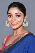 Pair of elegant Golden White Kundan and pearl drop earrings for women.