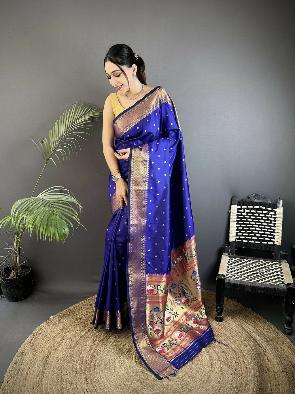 Royal blue soft Lichi silk saree with woven butti details and matching blouse.