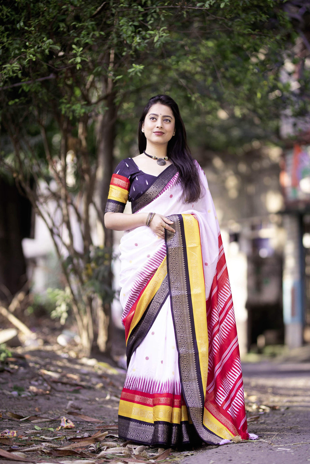 White Cotton Crepe saree with artistic prints and golden zari border